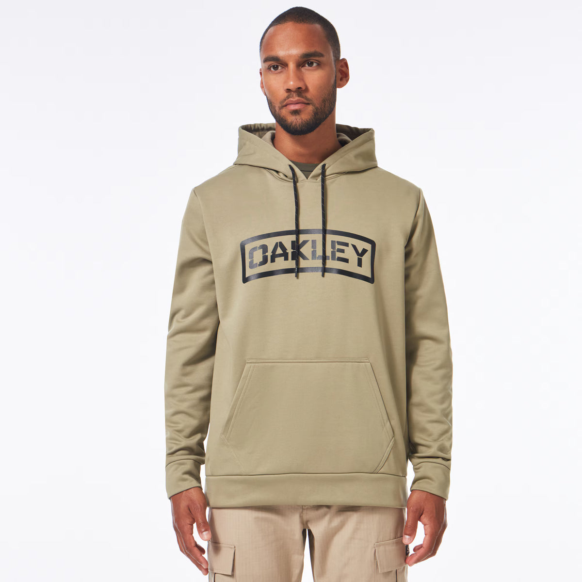 เสื้อรุ่น OAKLEY SI - SI Tab Hoodie Shadow เสื้อทรงมาตรฐาน สีครีม มีโลโก้ OAKLEY หน้าเสื้อ