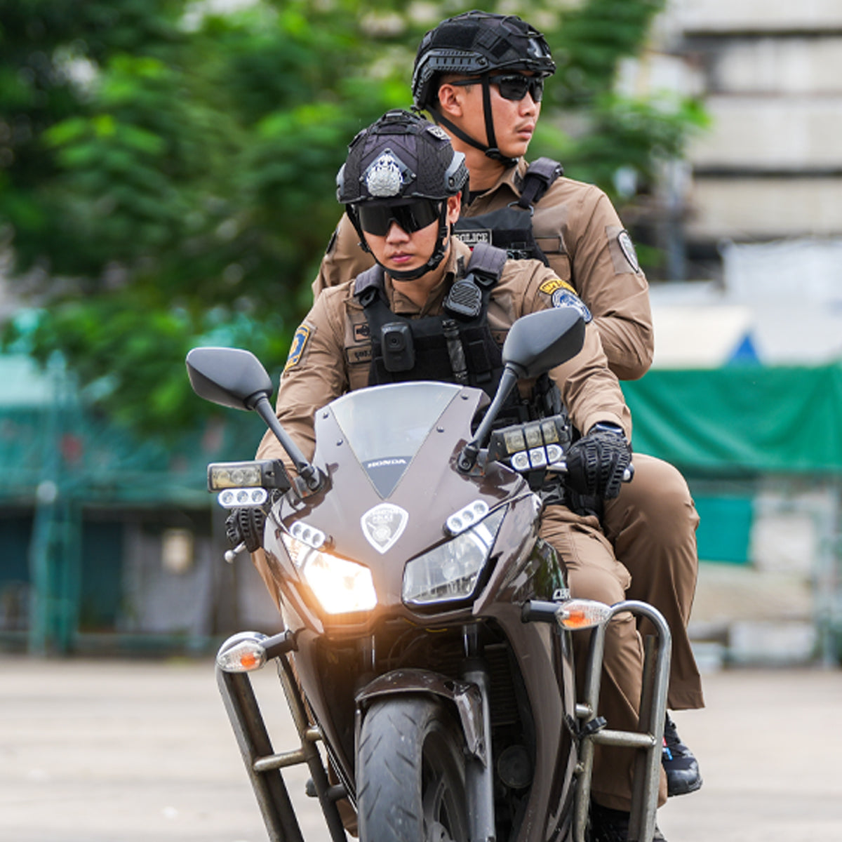 Two Thai Police Officers Riding Motorcycle Head-On View with Headlights On - Police Tactical Patrol